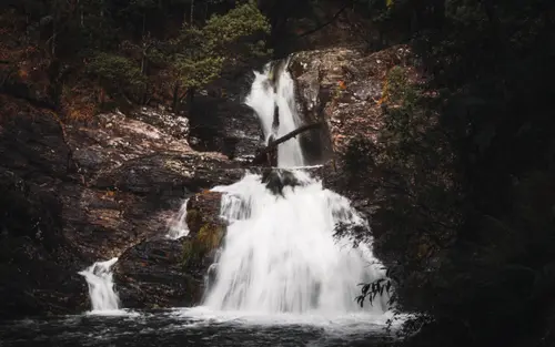 Moody Water On Rocks